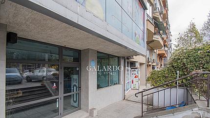 Two-level retail building with large windows in a communicative location