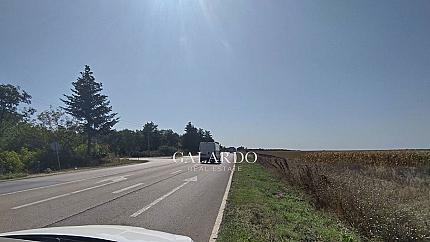 Flat plot of land in regulation on the main road E87, Topola village, region Dobrich